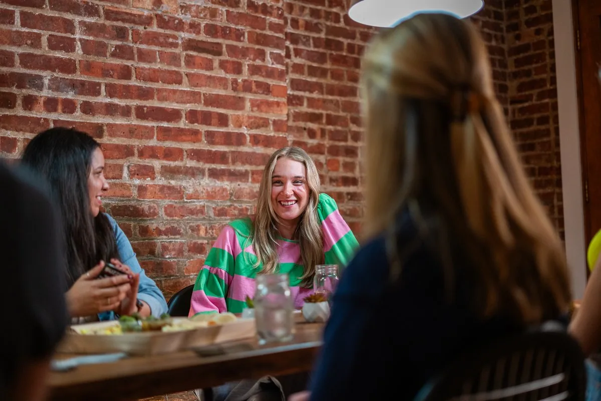 Hoboken Grace dinner group members gathering together from 2024