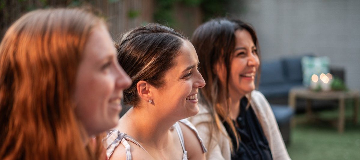 Members of a dinner group listening to someone share