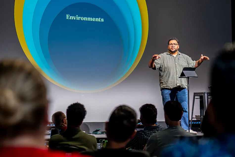 James Gray teaching in front of the five levels of change graphic
